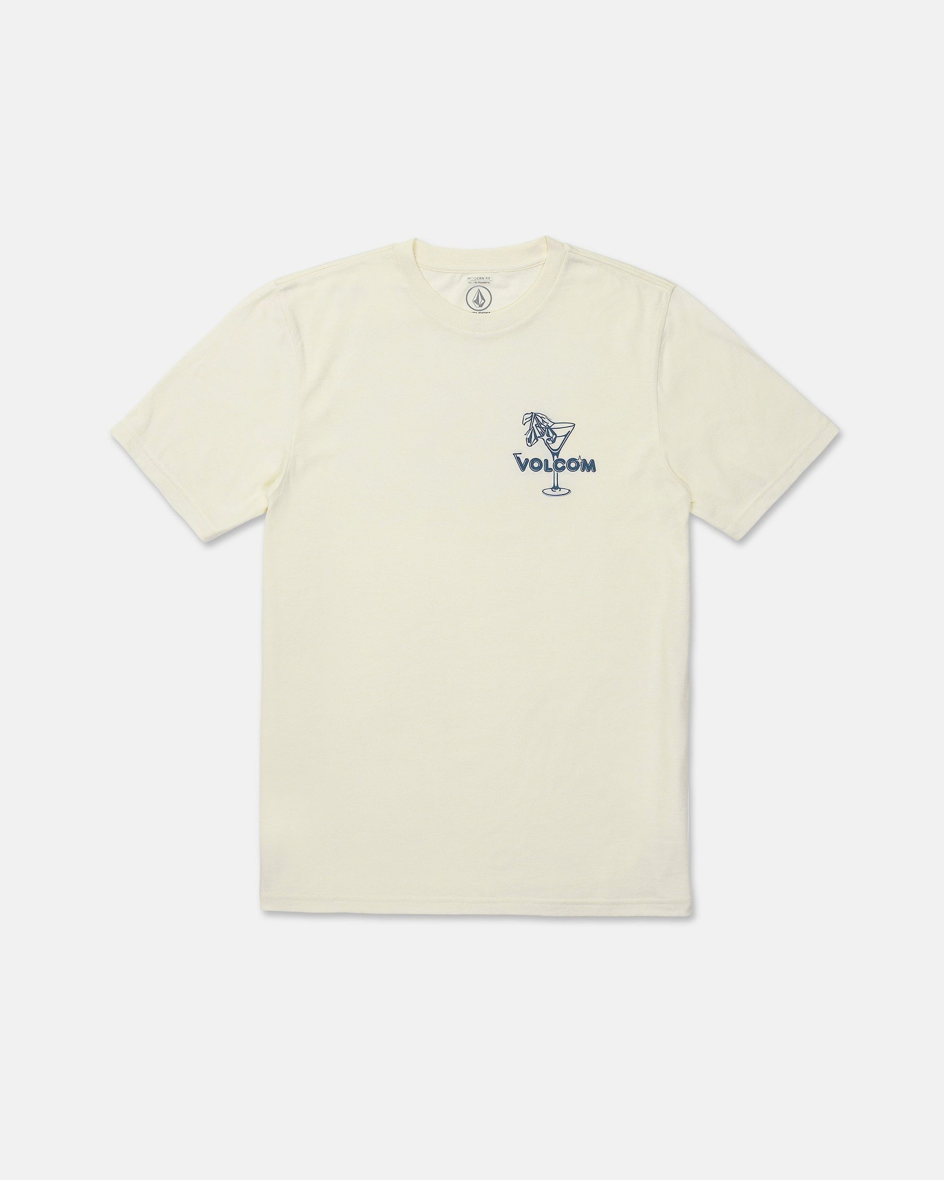 The Men's Dive Bar Short Sleeve Tee by Volcom features a cream color with a modern fit and short sleeves. Made from a soft ringspun cotton-poly blend, this t-shirt displays a small blue "VOLCOM" graphic on the left chest and showcases an illustration of a woman sitting on the rim of a cocktail glass.