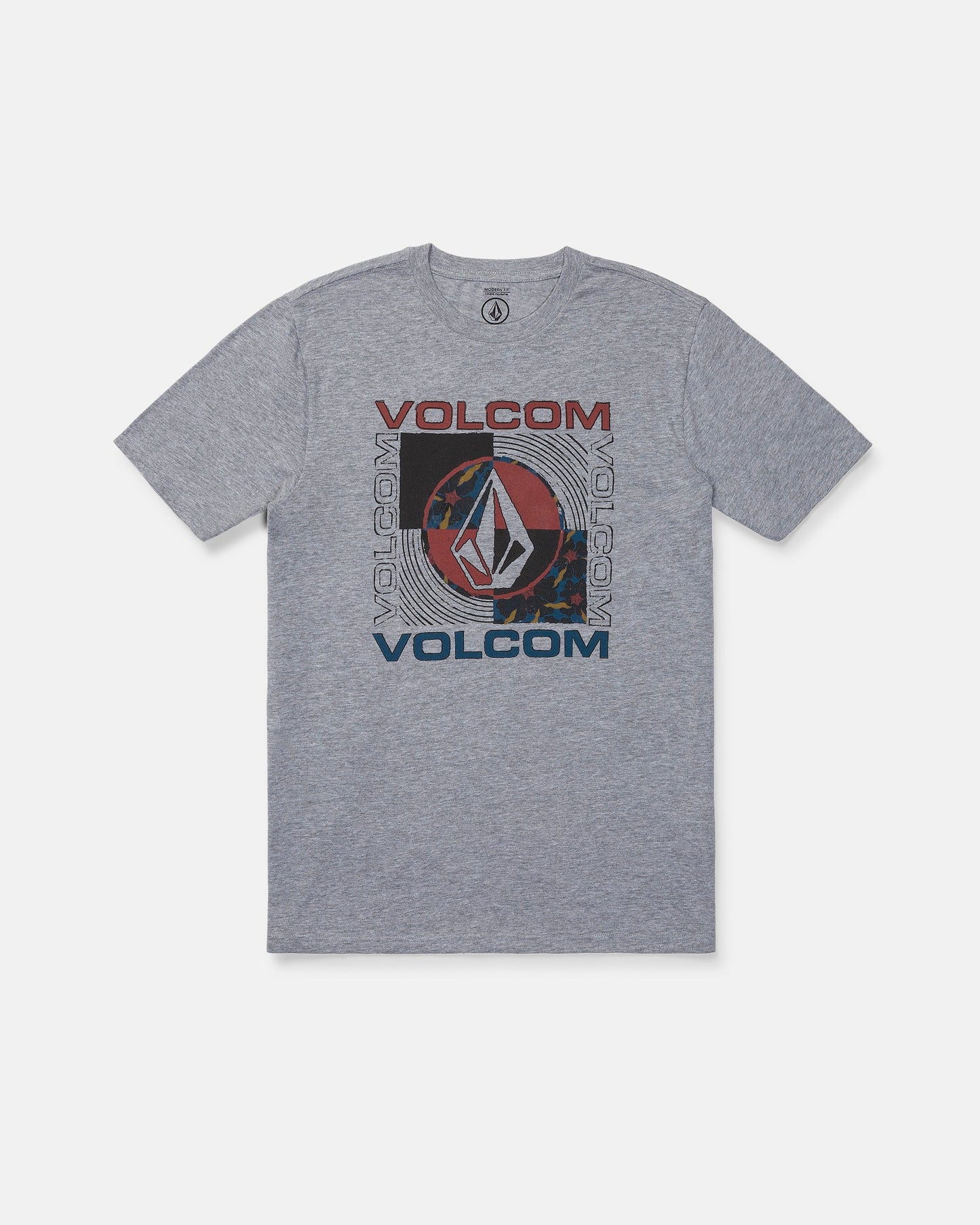 The Volcom Men's Filled Out Short Sleeve Tee is a medium-weight, gray heather t-shirt featuring the word "VOLCOM" and the iconic Volcom Stone logo in red, blue, and black—arranged both vertically and horizontally at the center. This modern fit tee is finished with a soft-hand screen print for all-day comfort.