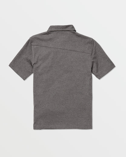 The Volcom Kids' Wowzer Polo Short Sleeve Tee is shown in heather gray, laid flat with the back side up. This modern fit polo features a straight hem, simple collar, and soft cotton-poly blend on a plain white background.