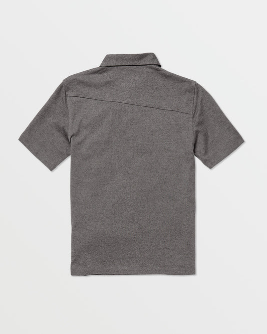 The Volcom Kids' Wowzer Polo Short Sleeve Tee is shown in heather gray, laid flat with the back side up. This modern fit polo features a straight hem, simple collar, and soft cotton-poly blend on a plain white background.