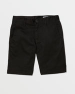 A pair of black Volcom Kids' Frickin Chino Shorts 16" with a modern fit, front pockets, belt loops, and a button closure is laid flat on a white background.