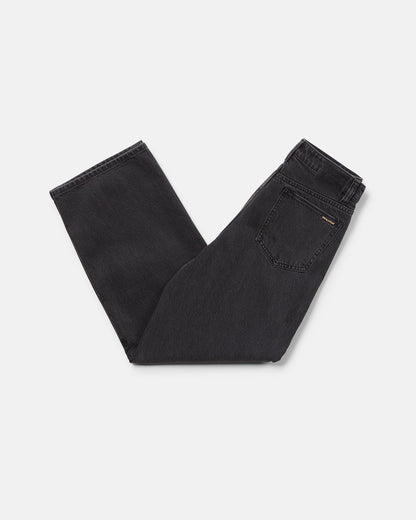 A pair of Volcom Boy's Big Boys' Billow Denim II Pants in black, folded neatly on a white background with the back pocket and waistband visible.