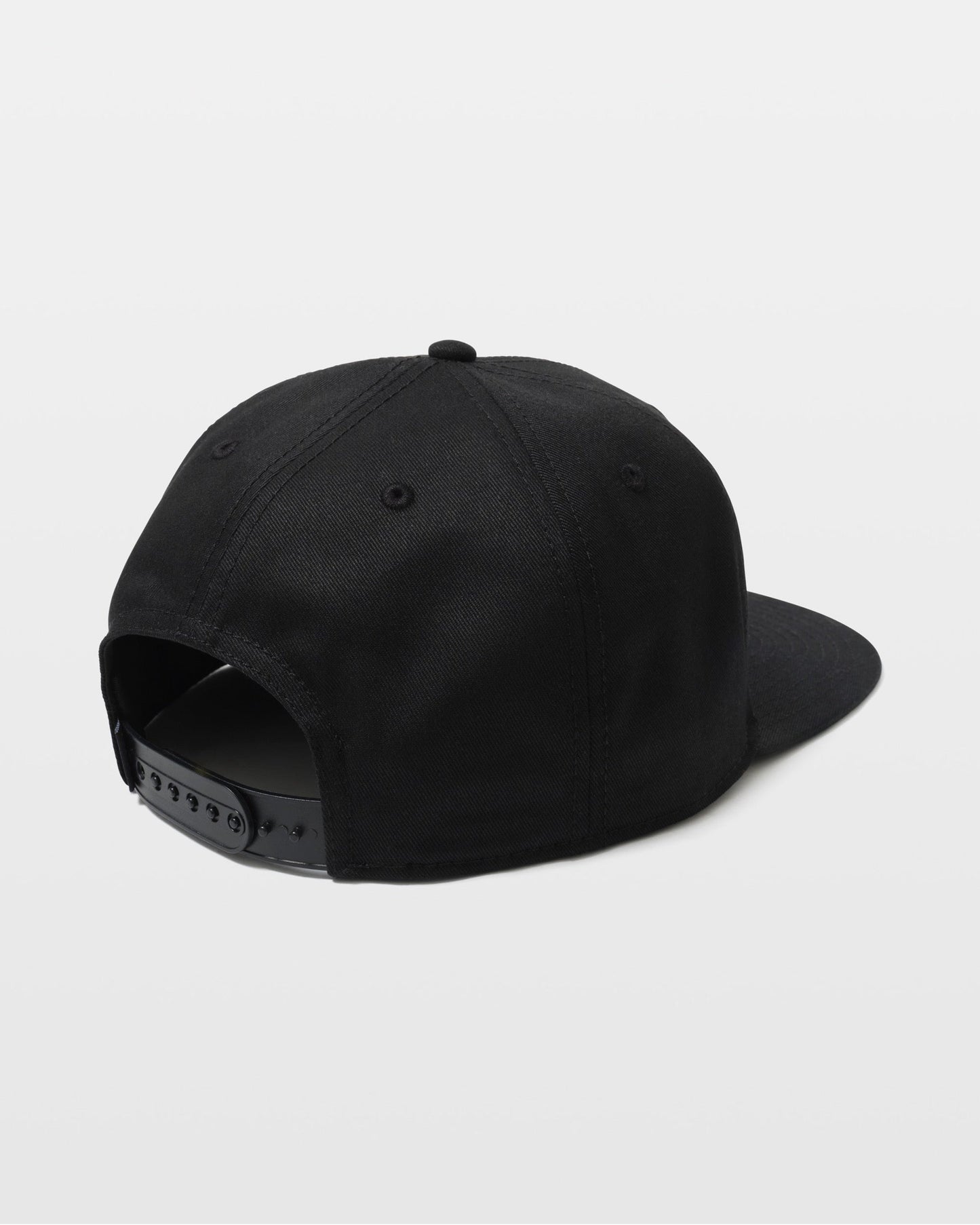 A black Volcom Men's Quarter Evo Twill snapback cap is shown from the back, with an adjustable plastic strap and curved brim, set against a plain white background.