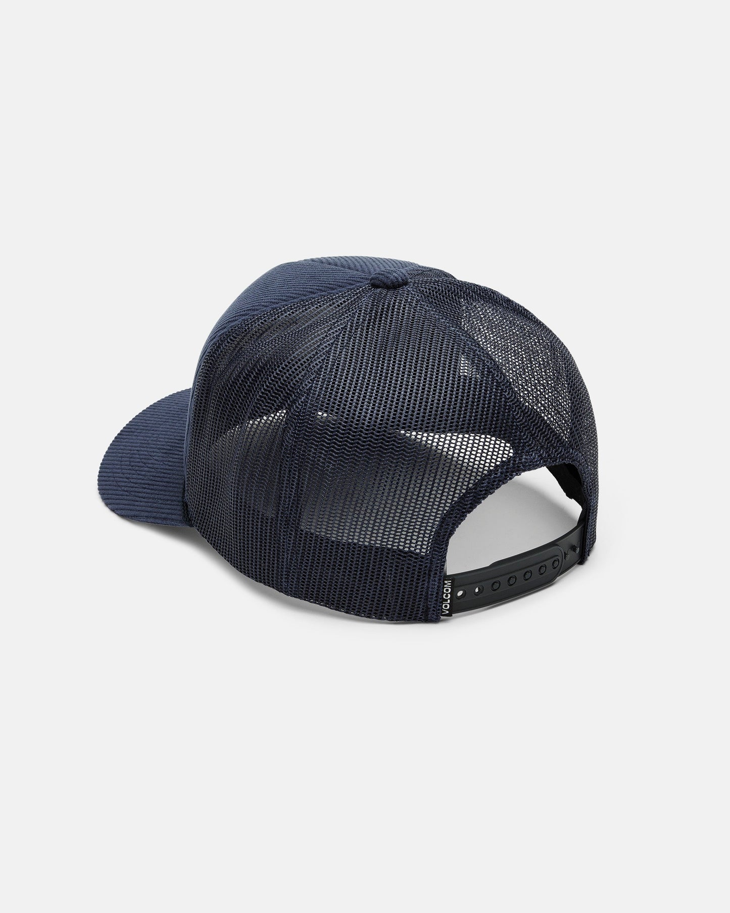 A Volcom Men's Overdrive Trucker is shown from the back in navy blue, featuring a breathable corduroy mesh design, an adjustable snapback closure, and a curved brim, all set against a plain white background.