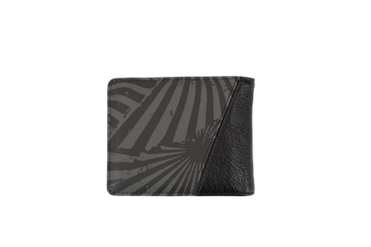 The Volcom Men's Solidstone Bifold wallet features an abstract striped pattern in black and gray with a textured black leather corner, displayed against a plain white background.