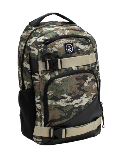 The Volcom Men's Grindstone Skate Backpack features a camo pattern with beige adjustable straps, a black bottom, multiple compartments, a dedicated laptop sleeve, and a front logo patch, shown against a white background.