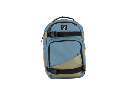 The Volcom Men's Grindstone Skate Backpack features a blue and khaki design with black straps and buckles, a small logo on the upper front, a top handle, ergonomic shoulder straps for comfortable carrying, and multiple compartments including a padded laptop sleeve.
