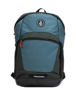 Introducing the Volcom Men's Slam School Backpack in blue and dark green, featuring a spacious main compartment, front zip pocket with a red zipper pull, and a black Volcom logo patch on the upper front. The bottom showcases a white Volcom logo, while the interior includes a padded laptop sleeve for enhanced protection.