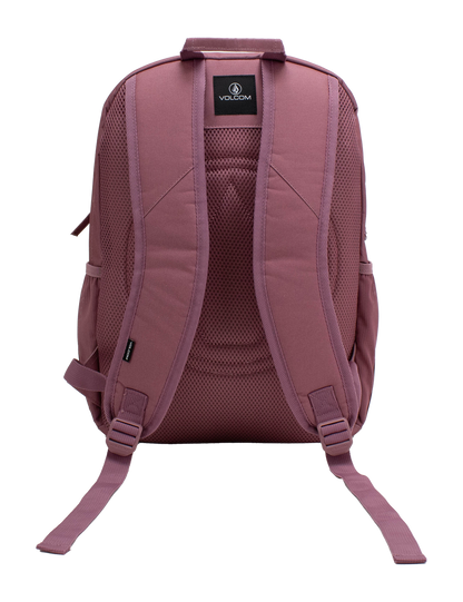 The Volcom Women's Study Buddy Backpackq in mauve is displayed from the back against a white background, highlighting its padded shoulder straps, mesh back panel, interior padded laptop sleeve, and adjustable bottom straps.