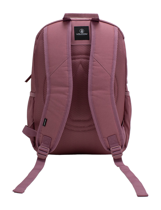 The Volcom Women's Study Buddy Backpackq in mauve is displayed from the back against a white background, highlighting its padded shoulder straps, mesh back panel, interior padded laptop sleeve, and adjustable bottom straps.