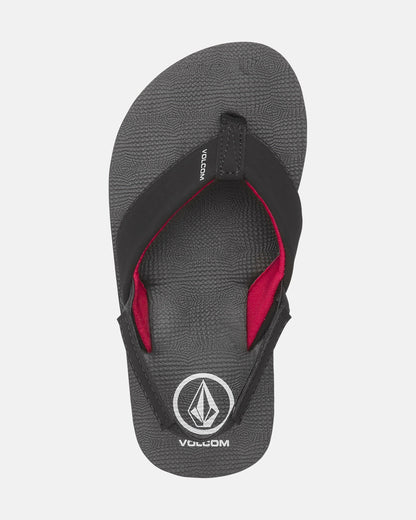 The Volcom Kids' Victor 2 Little Youth sandal is gray with a black and red strap, white Volcom logo on the footbed, and recliner comfort foam for extra cushioning. The product is shown against a plain white background.