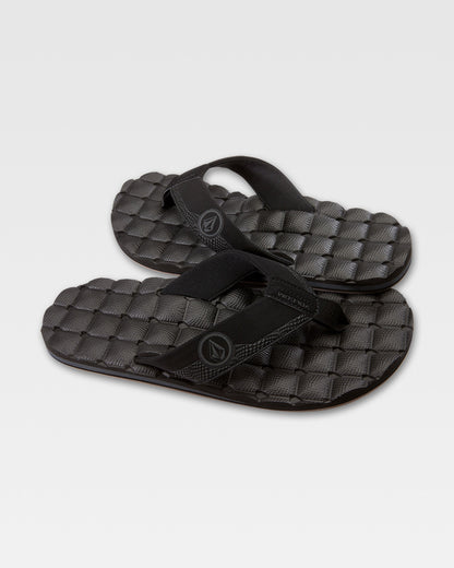 The Volcom Recliner sandals feature thick straps and a cushy, woven-pattern sole for a comfortable, grippy step—shown here in black against a plain white background.