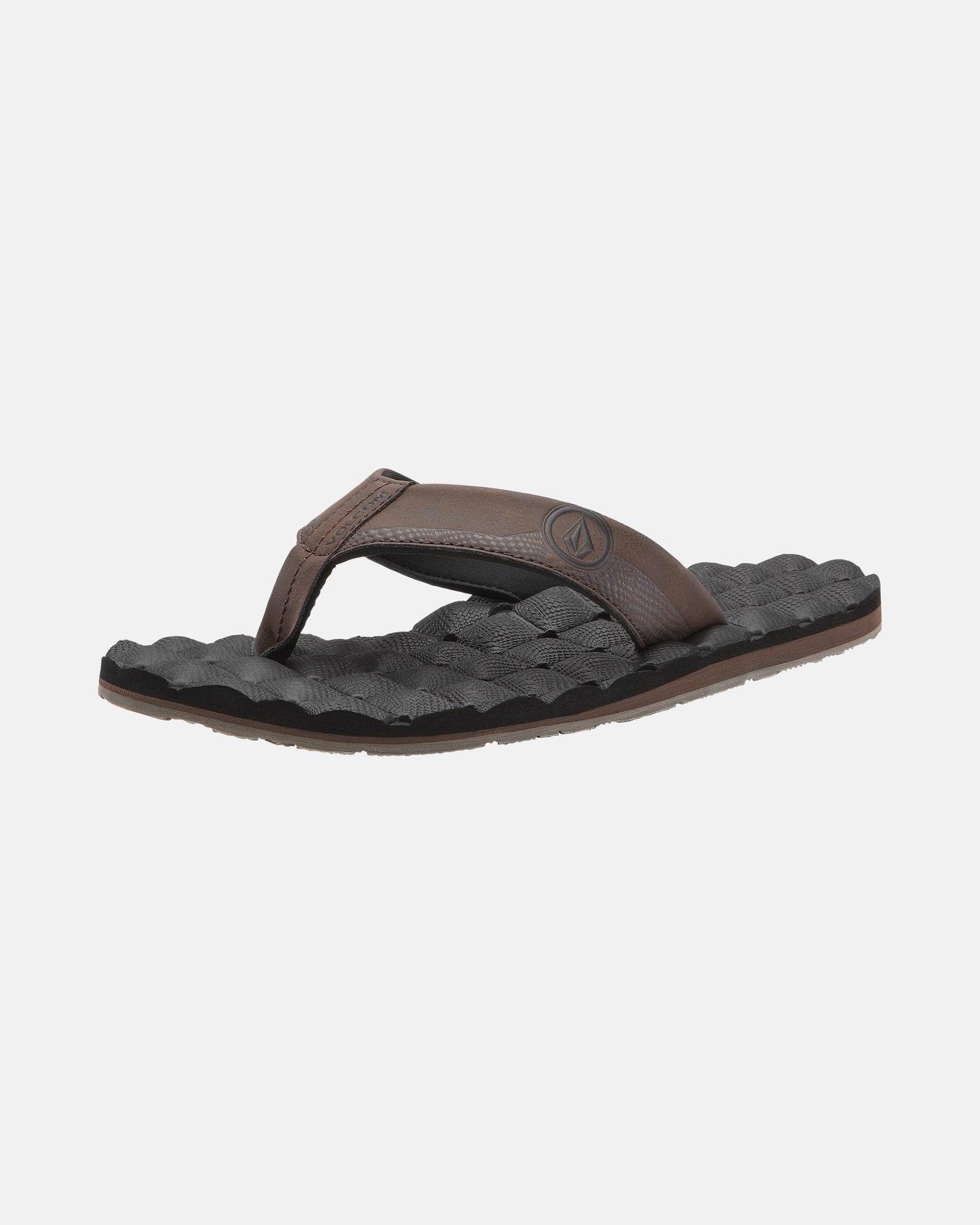 A single Volcom Men's Recliner flip-flop, featuring a brown strap and black woven-texture sole with extra grip, is displayed against a plain white background.