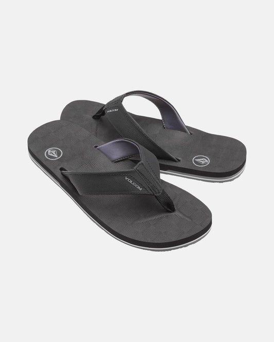 A pair of black Men's Victor Sandals by Volcom with textured soles, sturdy fabric straps, and Recliner Comfort Foam for support. These water-friendly sandals are shown on a plain white background.