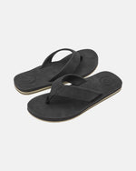 A pair of Men's Victor Sandals LX by Volcom in black, featuring textured straps and soles, displayed on a plain white background at an angle to show both the top and side views. Water-friendly design.