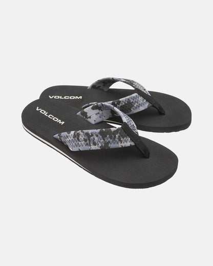A pair of Men's Daycation 2 sandals by Volcom, black with gray and black snakeskin-patterned straps and a molded rubber outsole, shown on a white background.