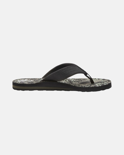 The Volcom Men's Daycation 2 Hawaii Sandals are black flip-flops with a patterned, abstract-design sole, shown in side profile against a plain white background.