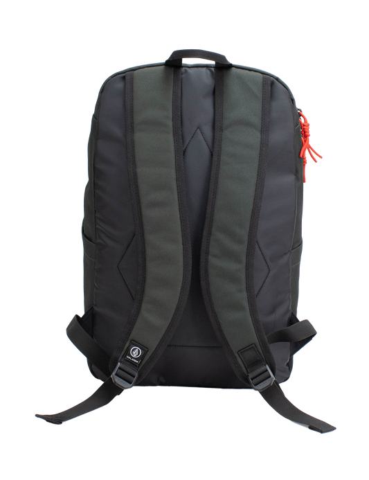 The Volcom Men's School Backpack is displayed from the back against a plain white background. It features ergonomic, padded shoulder straps, adjustable chest and waist straps, and a small Volcom logo near the bottom. A red zipper pull accents the right side. Inside, a padded laptop sleeve offers secure storage for your device.