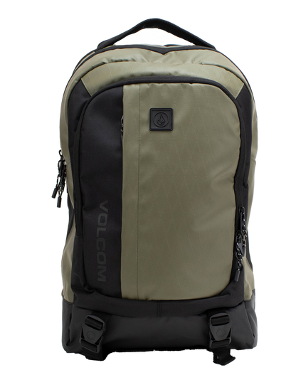 A Men's Venture Backpack by Volcom in green and black, featuring dual zippers, two front buckle straps, a padded laptop sleeve, and a top handle is displayed against a white background. With a 22L capacity, this backpack is ideal for both daily use and outdoor adventures.