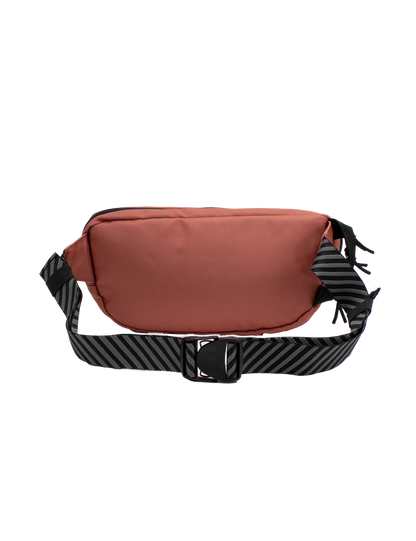 The Volcom Men's Mini Dos Waist Pack, featuring a reddish-brown design with a black zipper and an adjustable black strap adorned with diagonal gray stripes, is displayed on a plain white background.