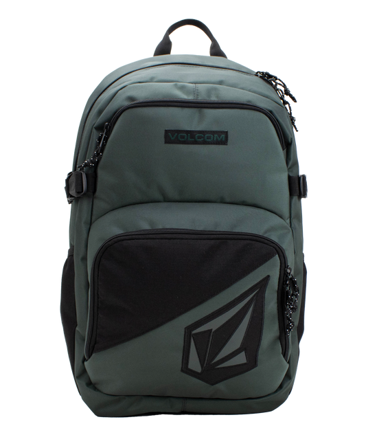 The Volcom Men’s Exponent Backpack in green features black zippers, a front pocket with the Volcom logo, and a top handle. This spacious backpack provides organized storage with two main zippered compartments and convenient side straps.