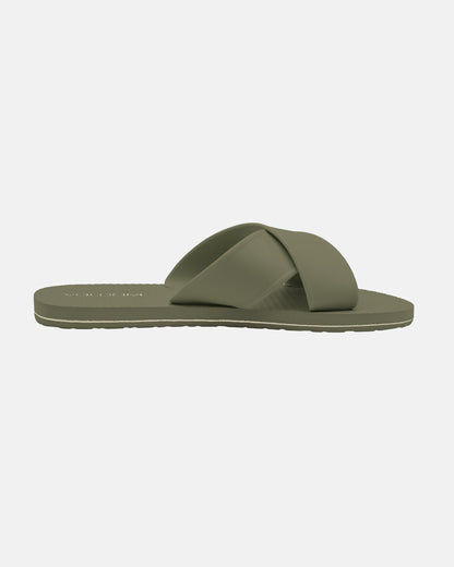 The Women’s Volcomotion Strap Sandal by Volcom is shown in olive green with a flat sole and two wide X-cross straps, displayed against a plain white background.
