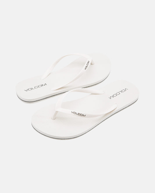 A pair of Volcom Volcomotion Womens white flip-flops with thin straps, featuring the black Volcom logo on the footbeds and straps, shown against a plain white background.