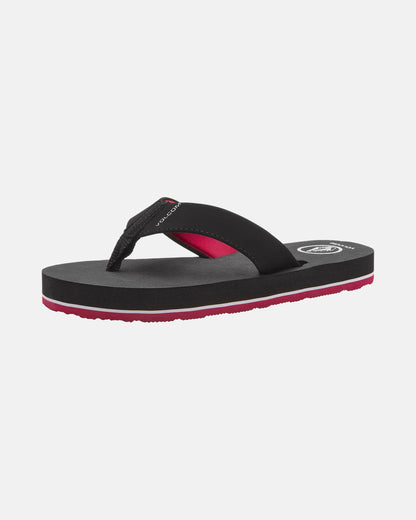 The Volcom Kids' Victor 2 Big Youth is a black, water-friendly sandal with a thick sole and red accents on the strap and lower sole, providing recliner-level comfort. Shown on a white background.